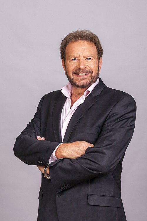 Dudu Fisher as Ezra Wolfson