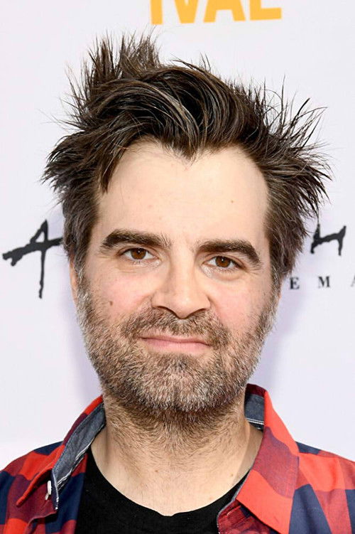 Joe Lynch as Guy on TV Screen (uncredited)