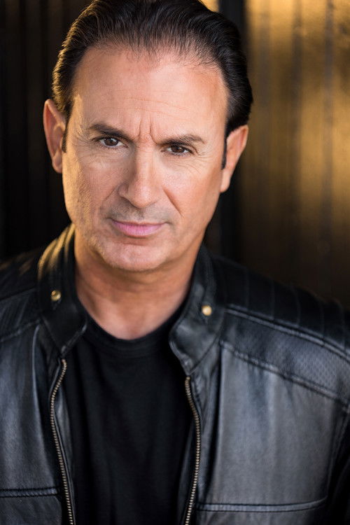 Julian Flynn as Assassin