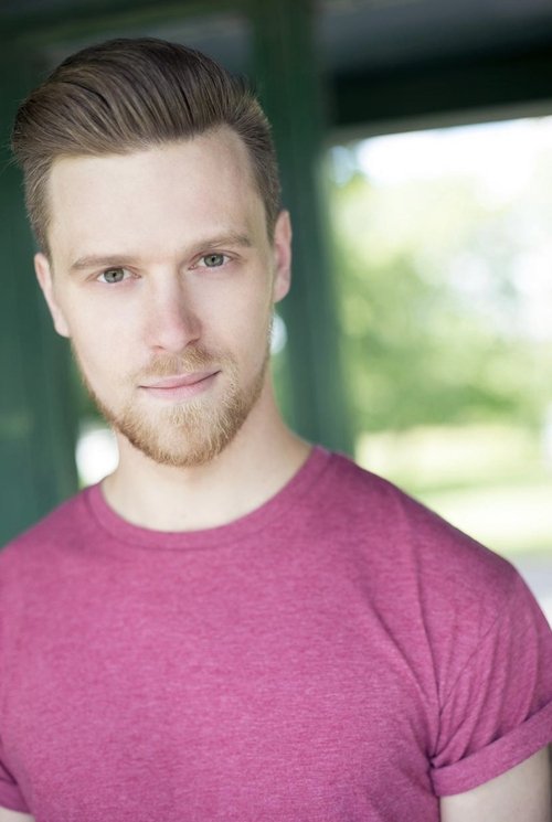 Joshua Tonks as News Anchor #1