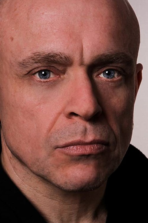 Gary Hailes as Dominic Barton