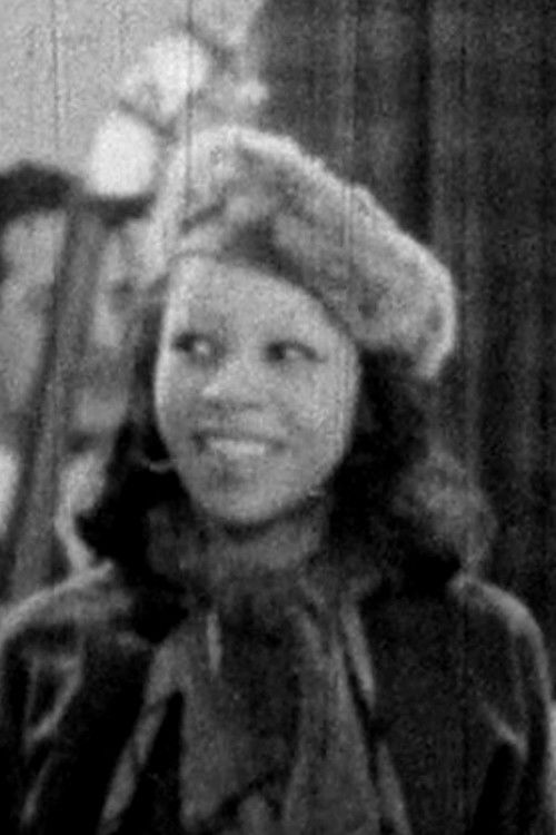 Doli Armenra as Miss Watkins, a Trumpet Player