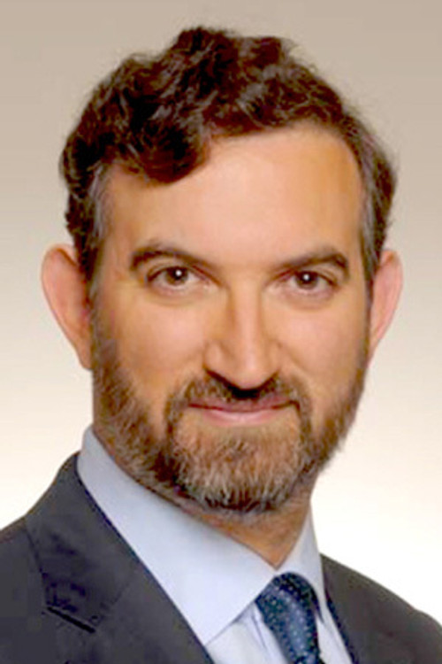 Adrian Dearnell as Newscaster