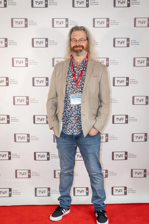 Robert Aaron Mitchell as The Doorman