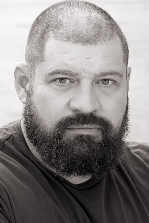 Brad William Henke as Andrew